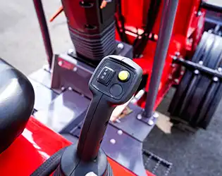 How does a compact wheel loader compare to a skid steer loader?