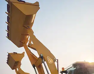 What is the lifting capacity of a compact wheel loader?